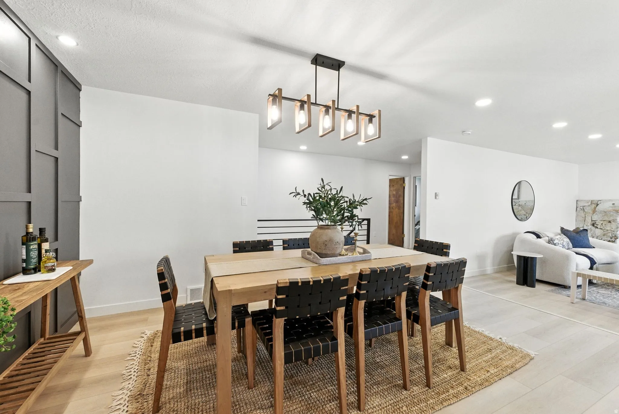 Dining room with recessed lighting and light wood-style flooring