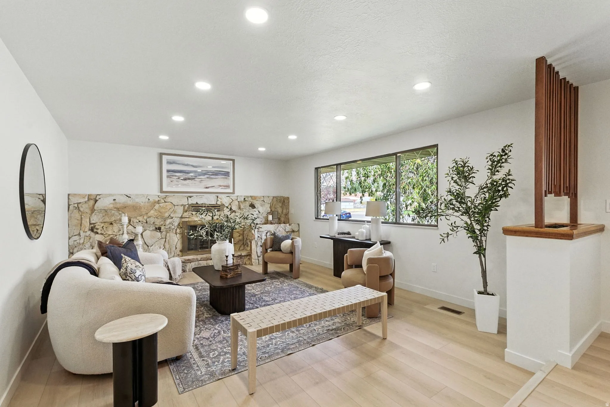 Living room featuring light wood-style floors and recessed lighting