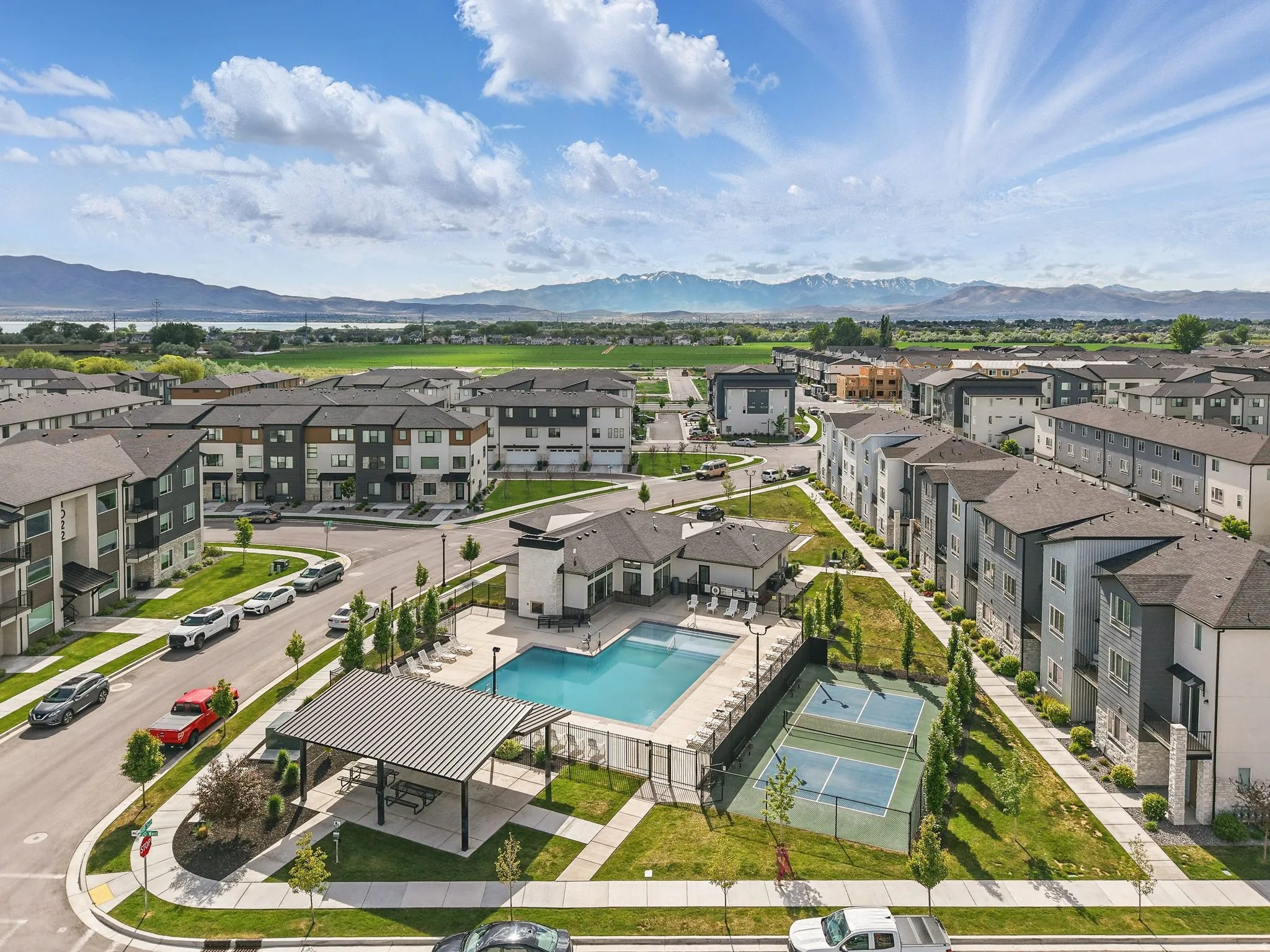 Aerial perspective of suburban area with mountains and a pool area