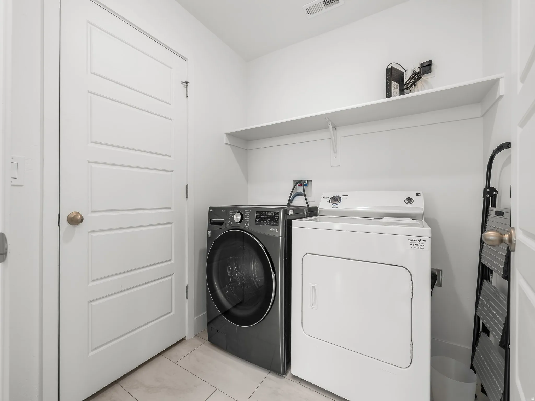 Laundry room featuring washing machine and dryer