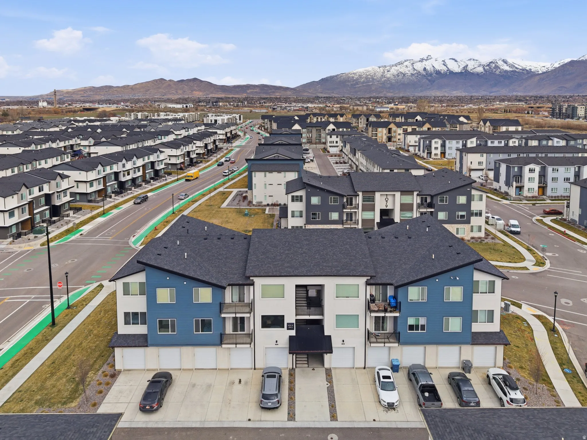 Aerial perspective of suburban area with a mountain backdrop