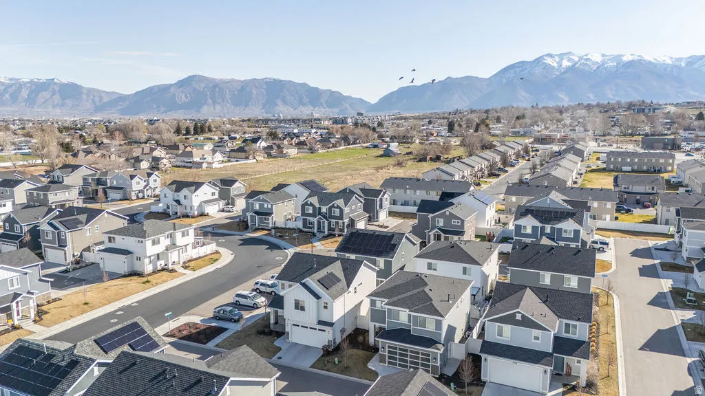 Aerial perspective of suburban area with a mountain backdrop