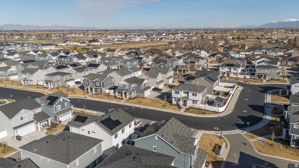 Aerial view of residential area featuring a mountain backdrop