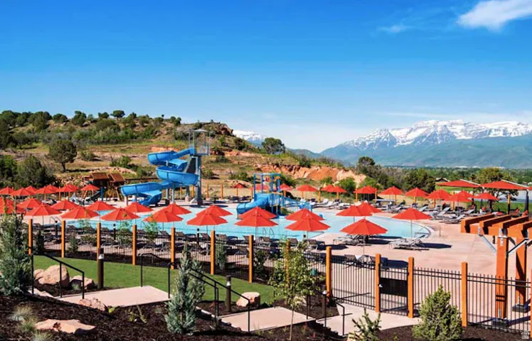 View of swimming pool with a mountain view