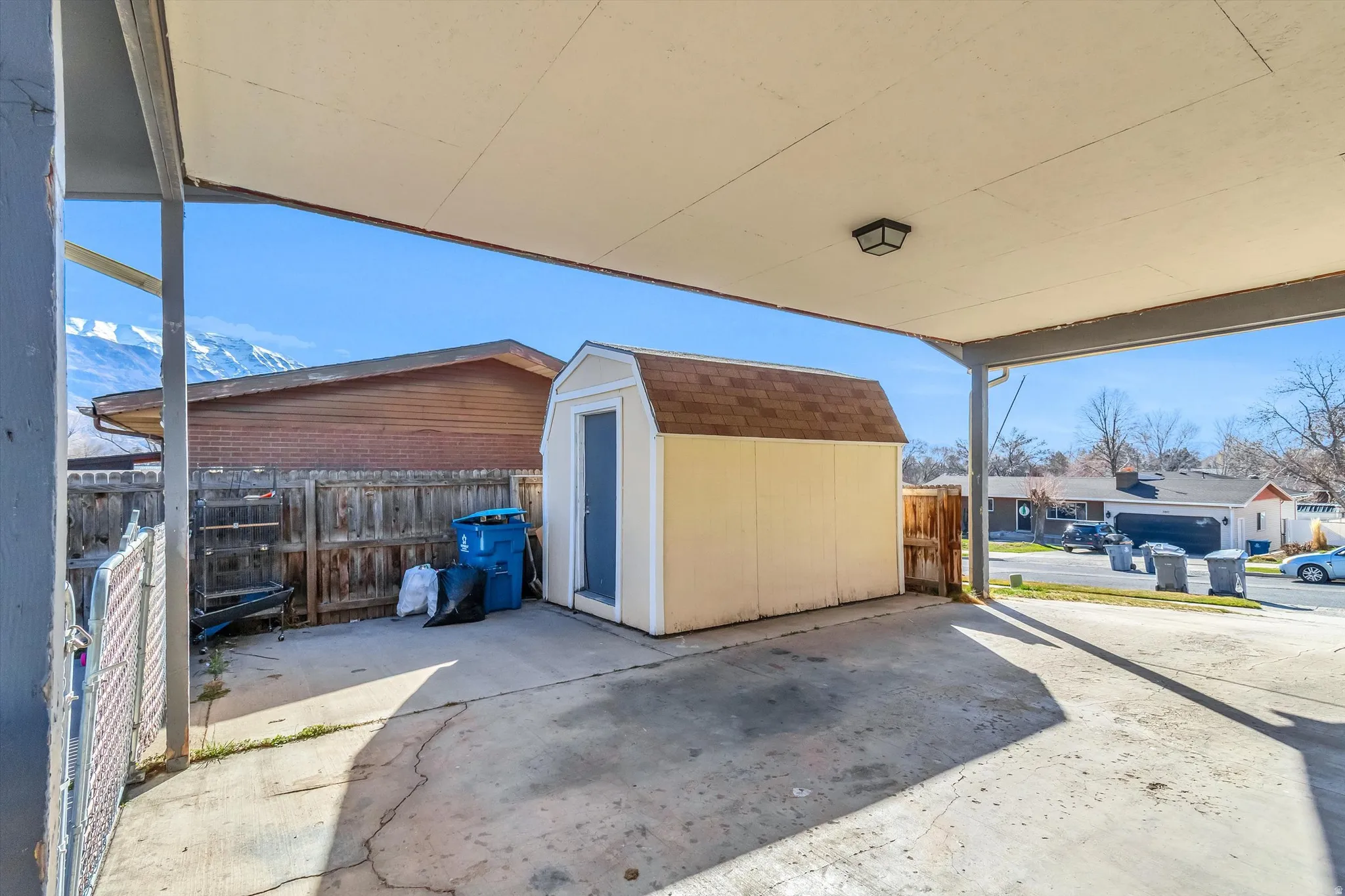 Fenced backyard with a shed