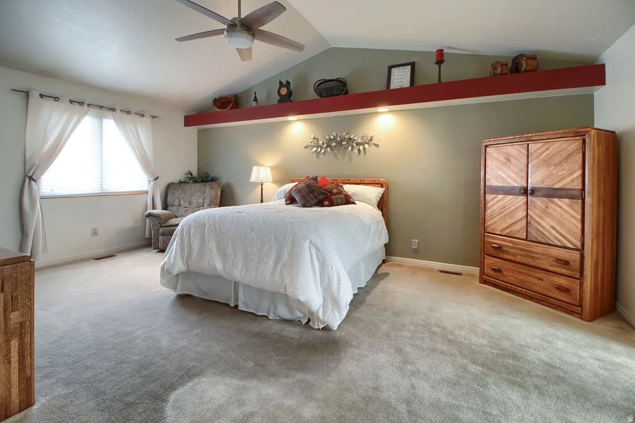 Bedroom featuring carpet flooring and ceiling fan