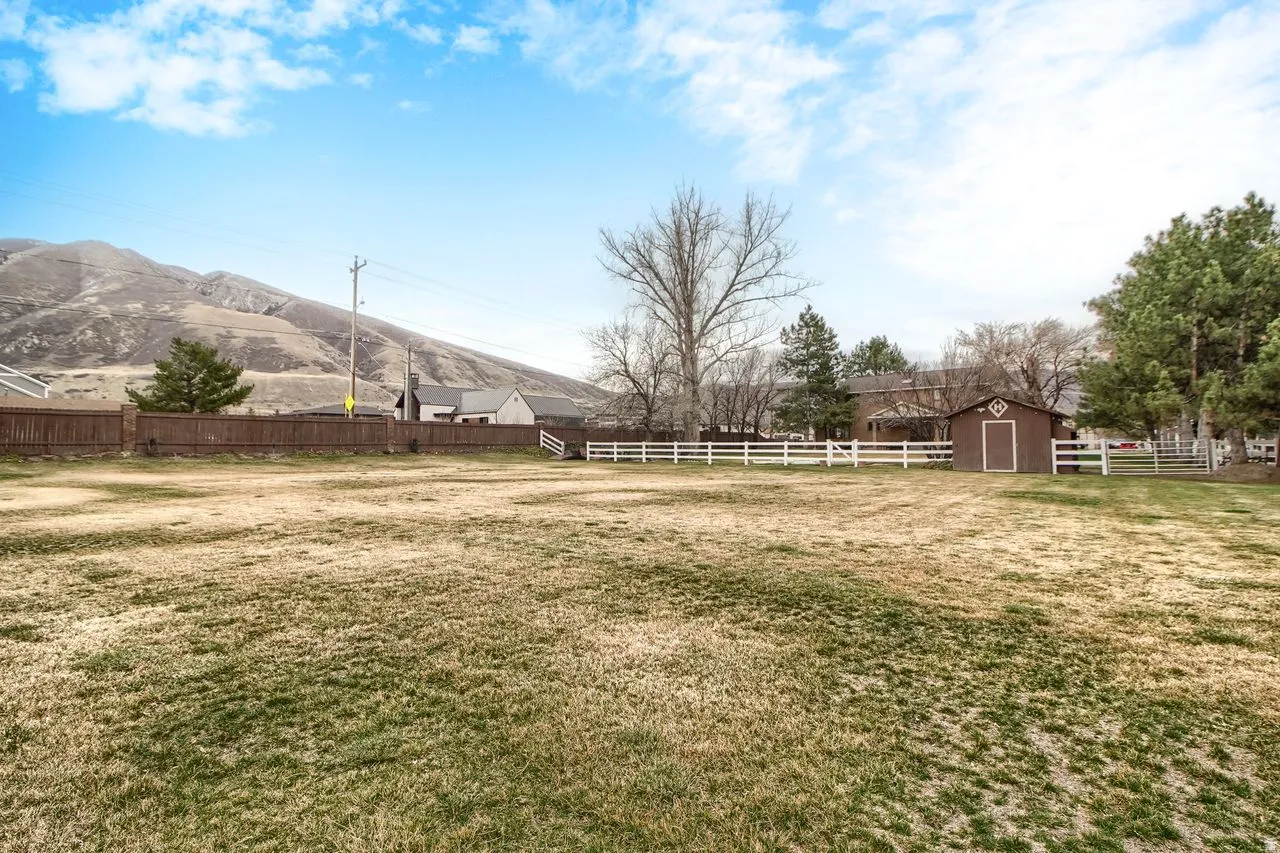 View of yard featuring an outdoor structure and a mountain view