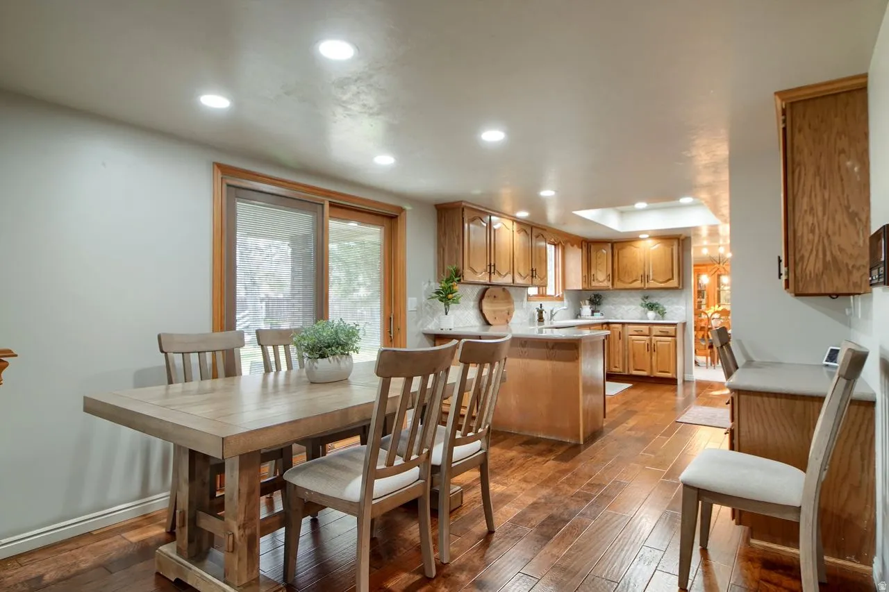 Dining room with recessed lighting and light wood-style floors