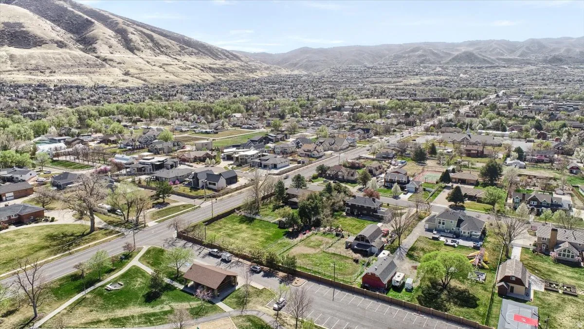 Aerial perspective of suburban area with a mountainous background