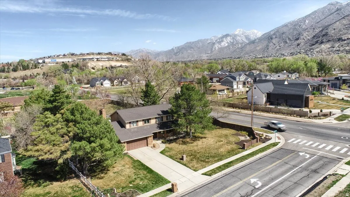Aerial view of residential area featuring mountains