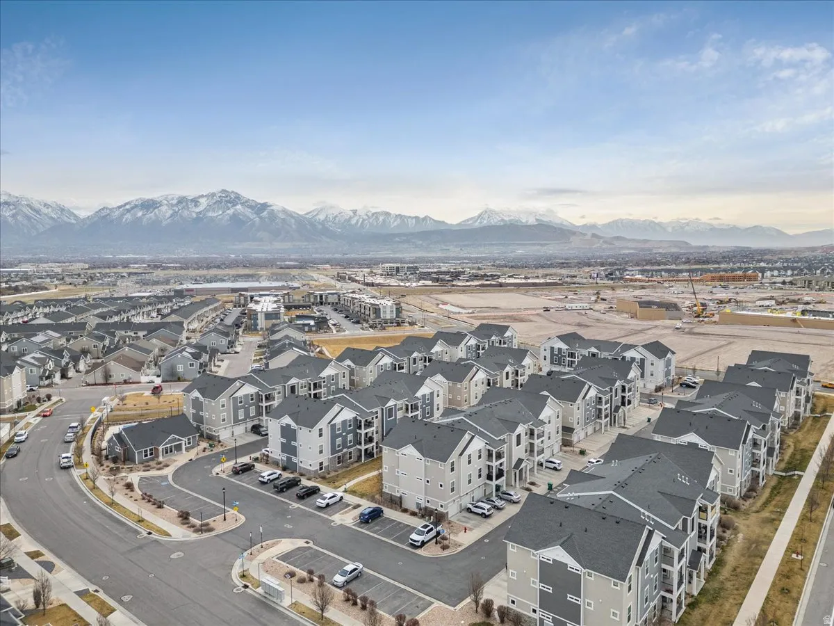 Aerial perspective of suburban area featuring a mountain backdrop
