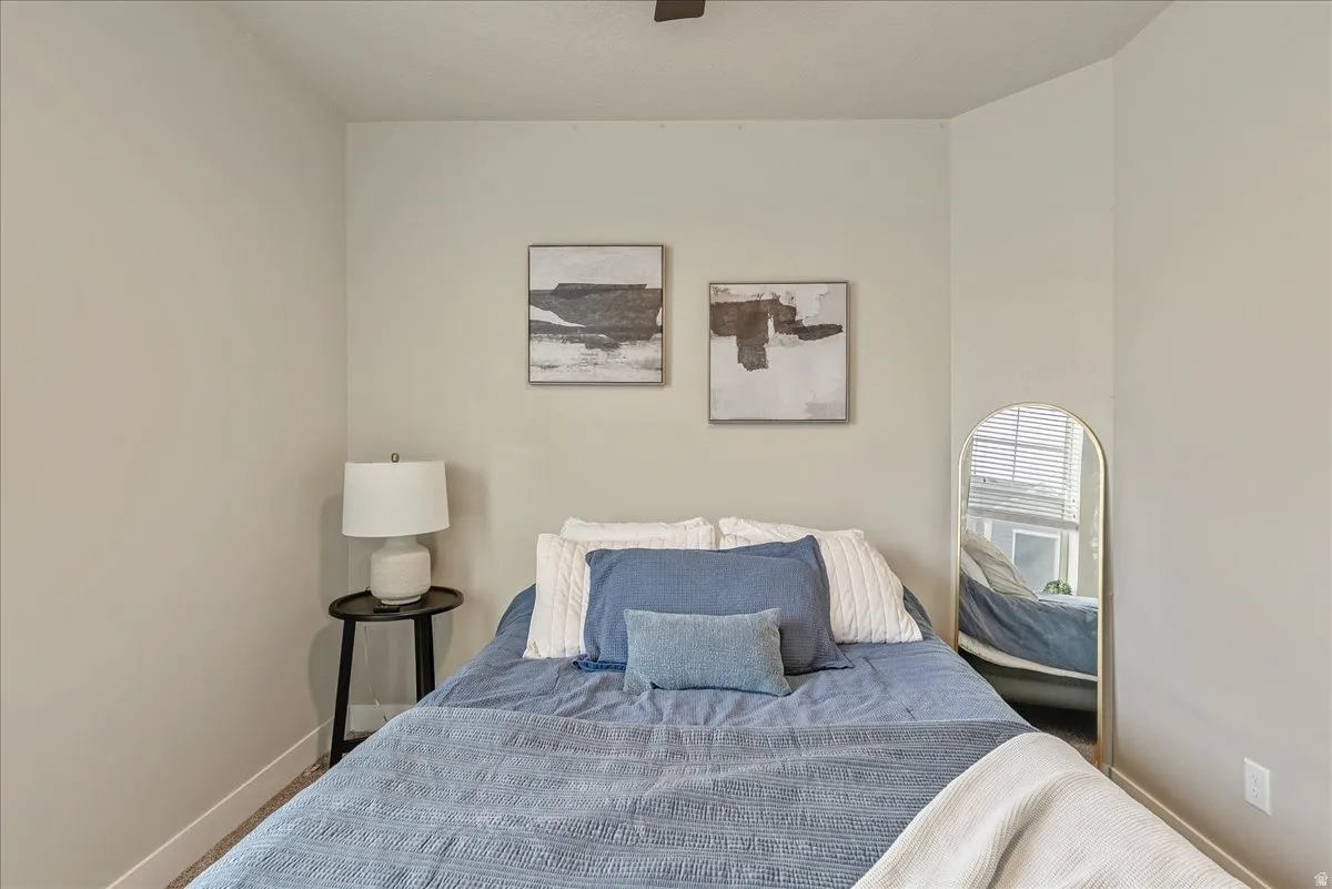 Bedroom featuring baseboards and a ceiling fan