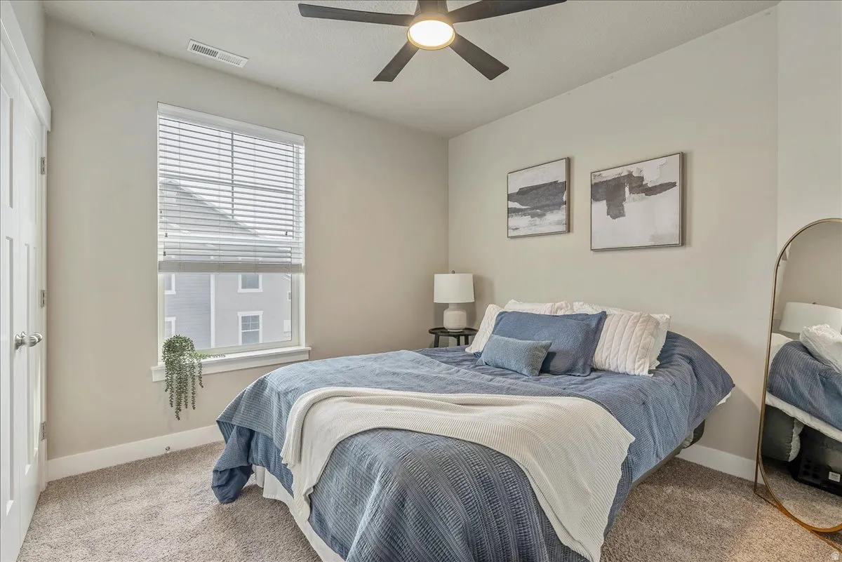 Bedroom featuring carpet floors and a ceiling fan