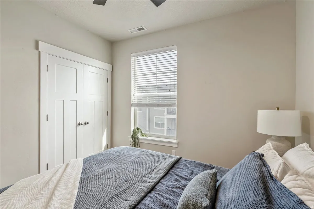 Bedroom with a closet and ceiling fan