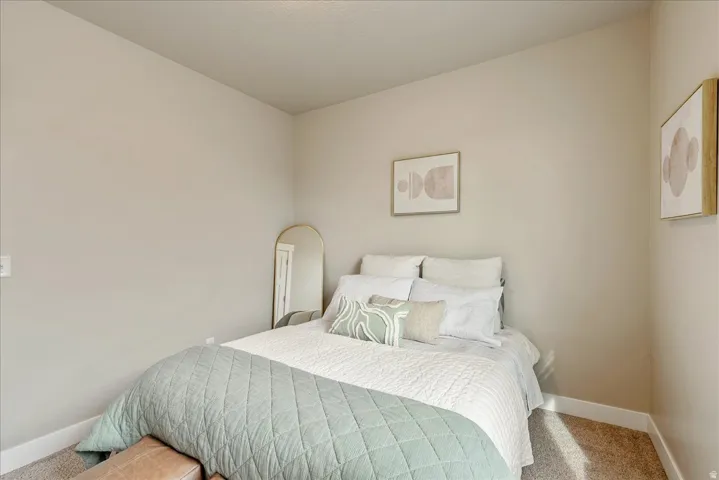 Bedroom with carpet and baseboards
