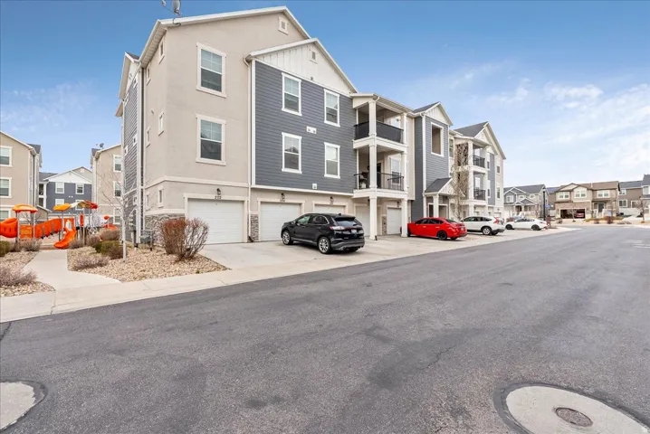 View of asphalt road featuring a residential view