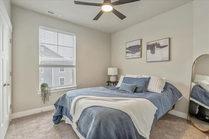 Bedroom featuring carpet floors and a ceiling fan