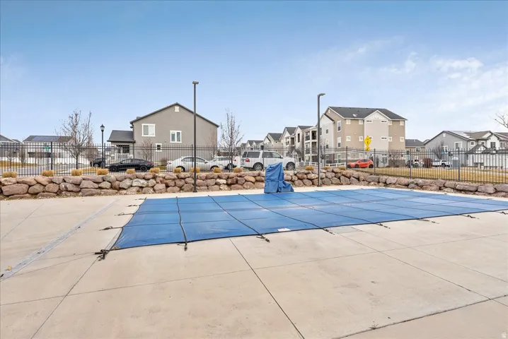 Community pool featuring a residential view
