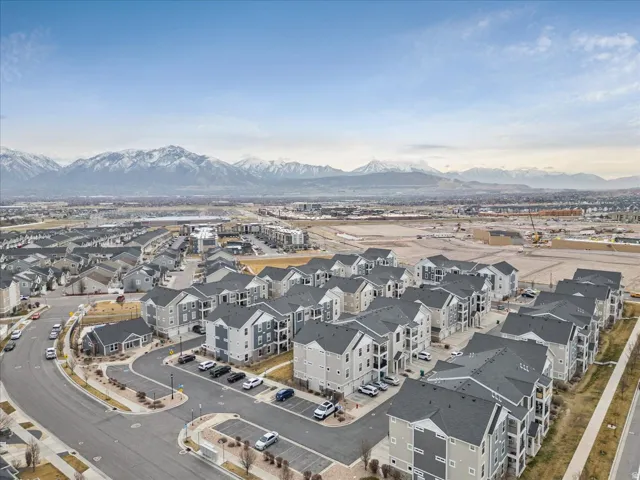 Aerial perspective of suburban area featuring a mountain backdrop