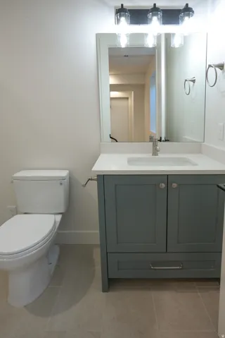 Bathroom with vanity and light tile patterned floors