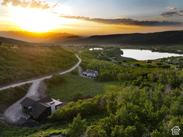 Aerial view at dusk of a water and mountain view