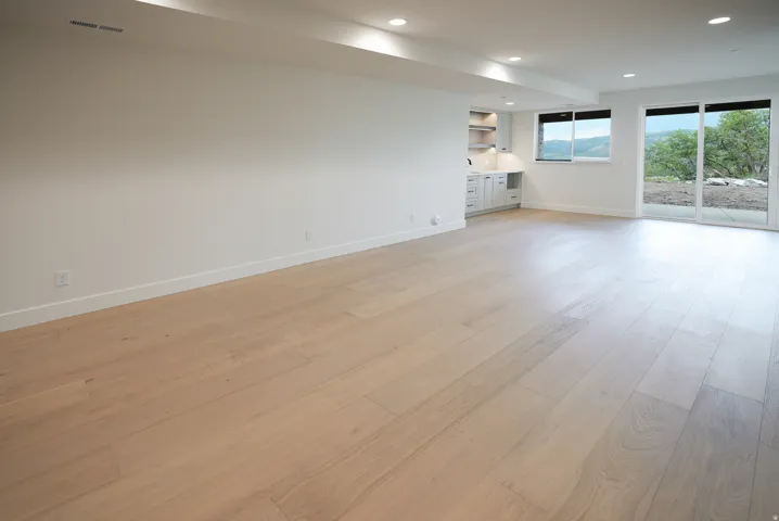 Unfurnished living room with light wood-style floors and recessed lighting