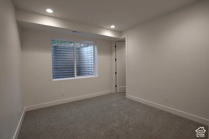 Unfurnished room featuring carpet and recessed lighting