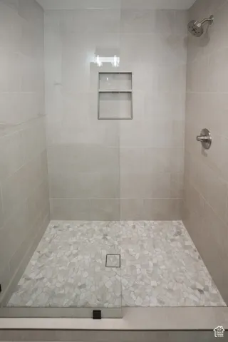 Full bathroom featuring a stall shower