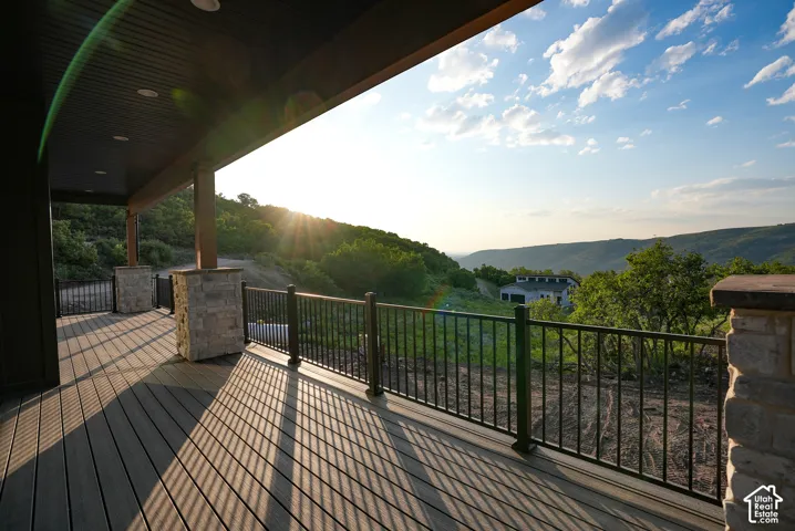 Wooden terrace featuring a mountain view