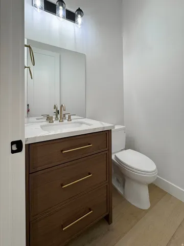 Bathroom with vanity and light wood-type flooring