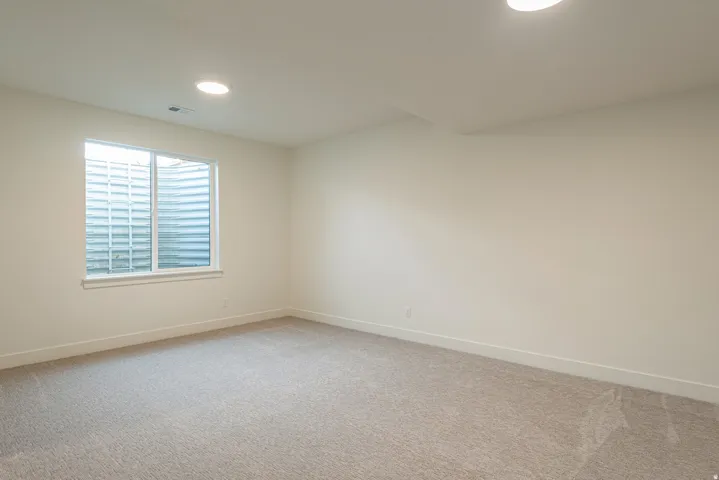Spare room with carpet and recessed lighting
