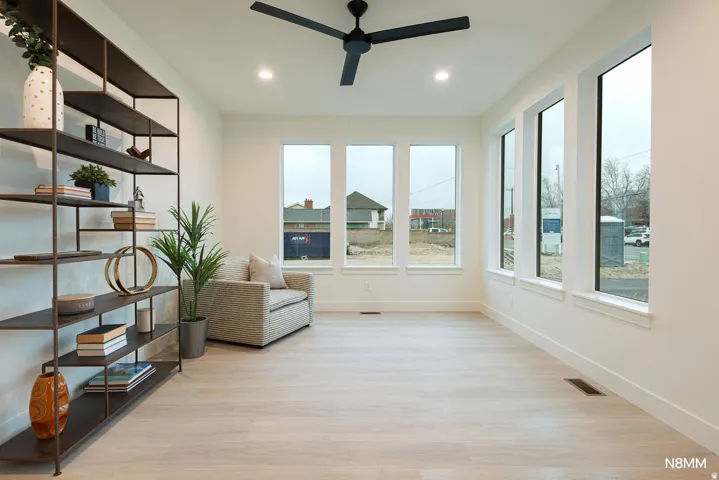 Den or office with a ceiling fan, light wood-style flooring, and recessed lighting