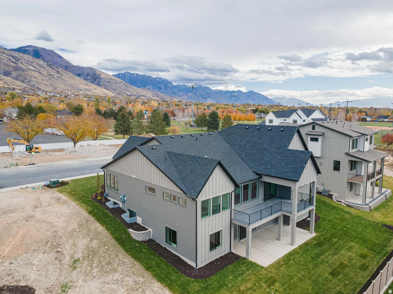 Aerial perspective of suburban area with a mountainous background