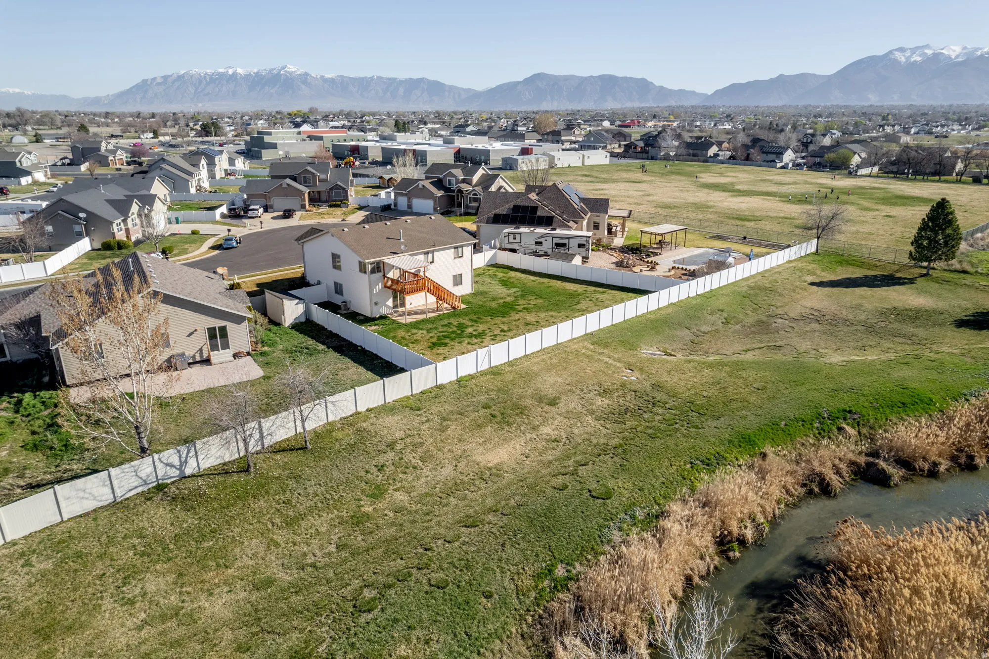 Aerial view of residential area featuring a mountainous background