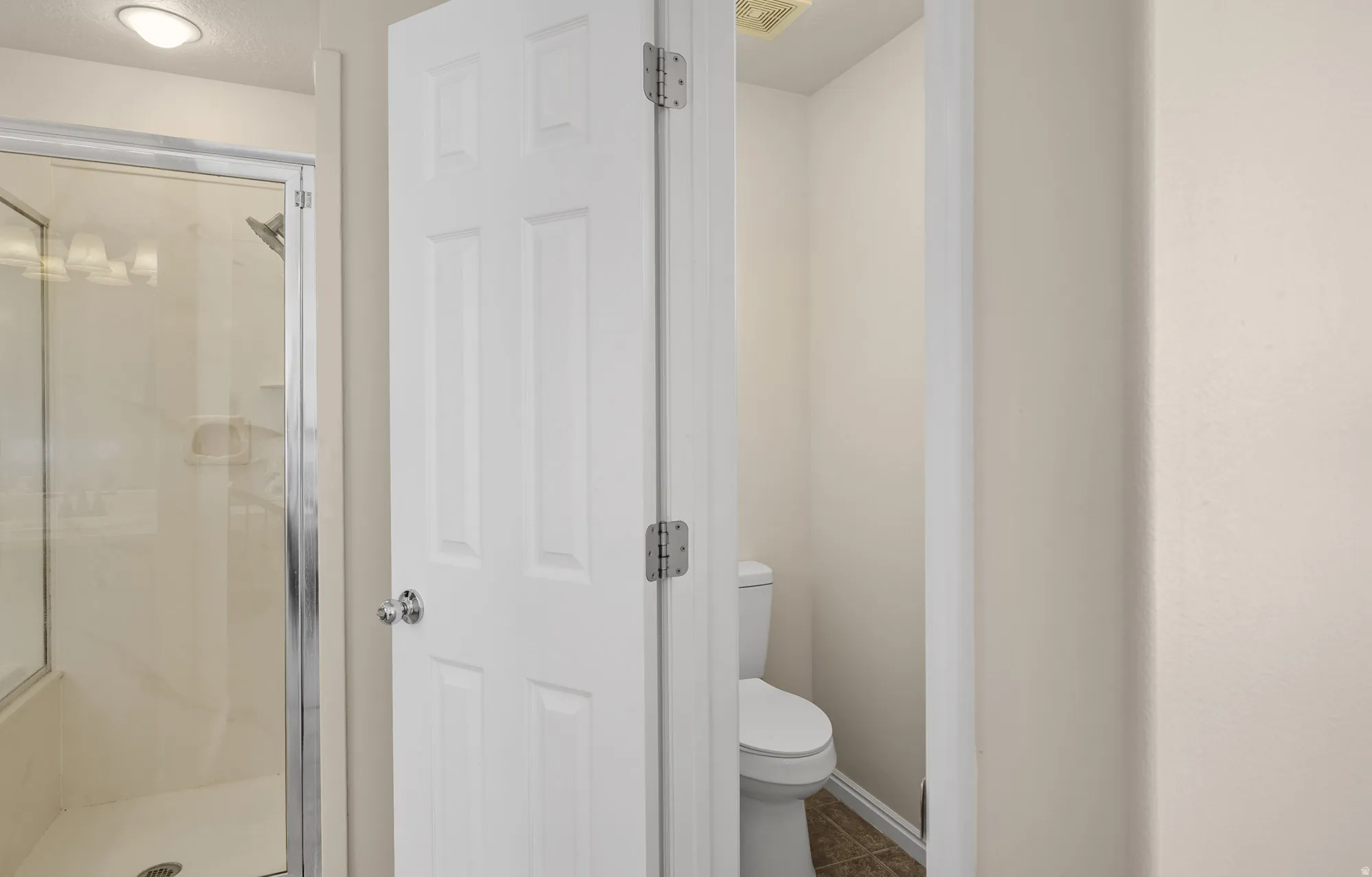 Master Bathroom Toilet Closet with Window and Fan