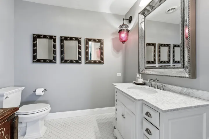 Bathroom with vanity and light tile patterned flooring