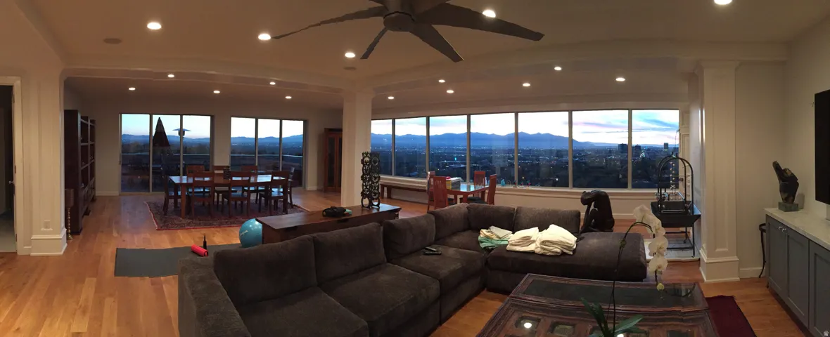 Living room featuring light wood-style flooring, a ceiling fan, recessed lighting, and healthy amount of natural light