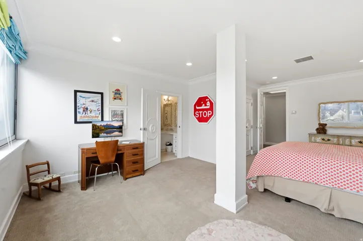 Bedroom featuring light colored carpet, ornamental molding, a desk, and recessed lighting