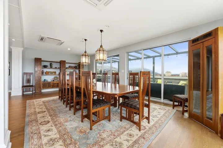 Dining room featuring wood finished floors and suspended lighting