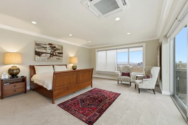 Bedroom featuring recessed lighting, crown molding, and light carpet
