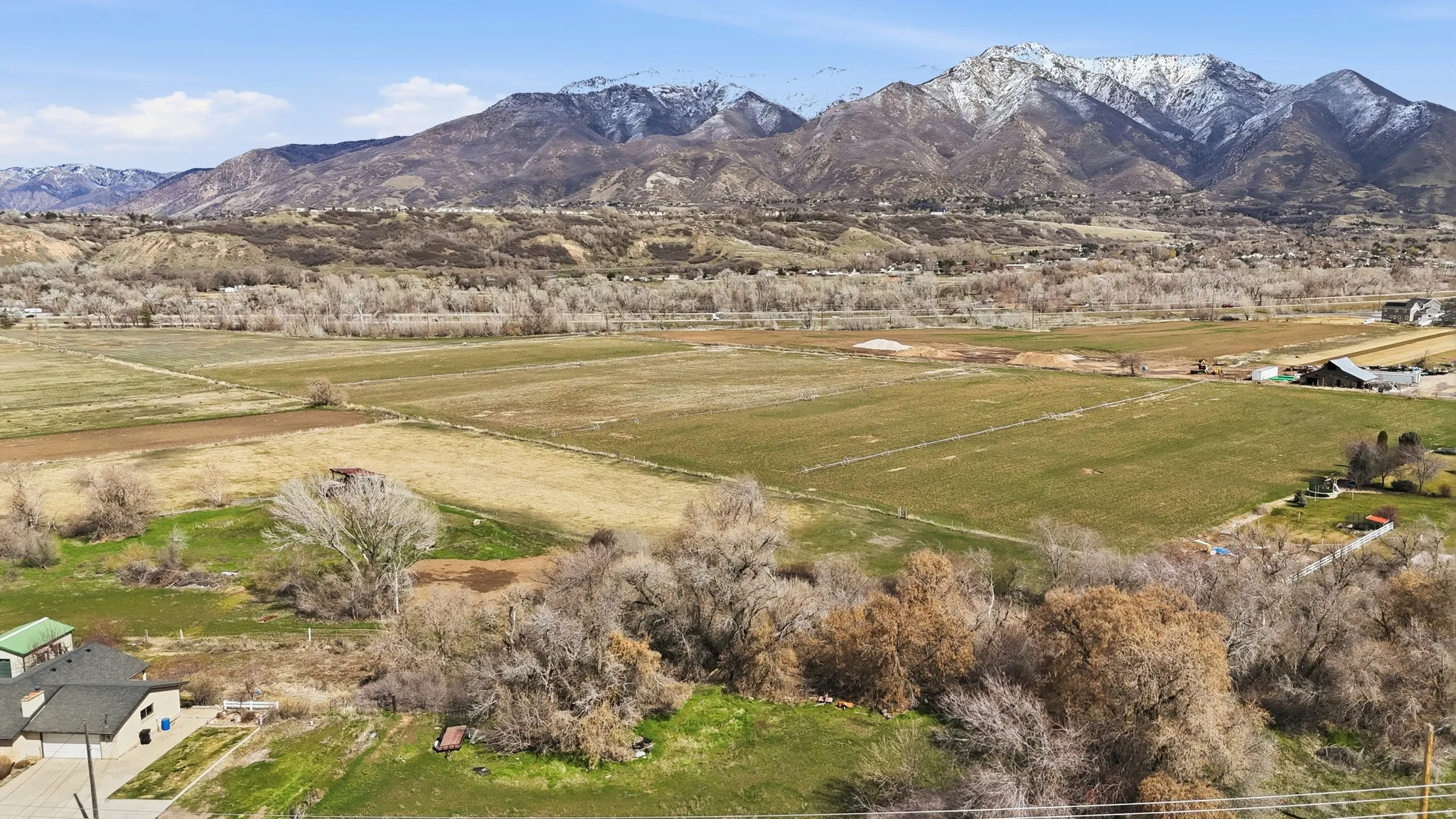View of mountain backdrop with rural landscape