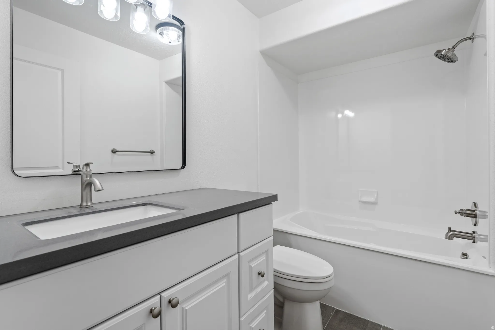 Full bathroom featuring vanity and bathing tub / shower combination