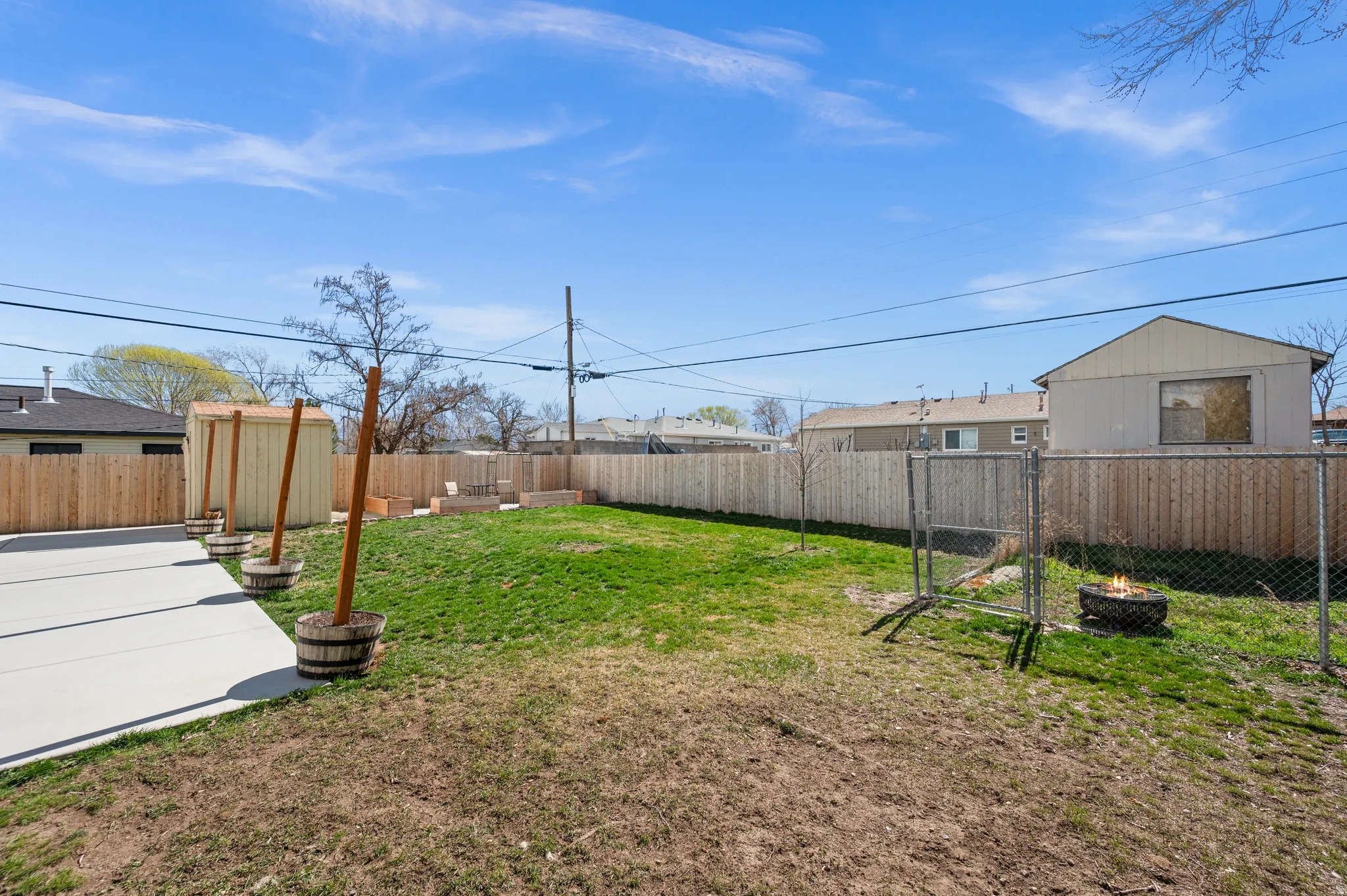 Fenced backyard with a gate