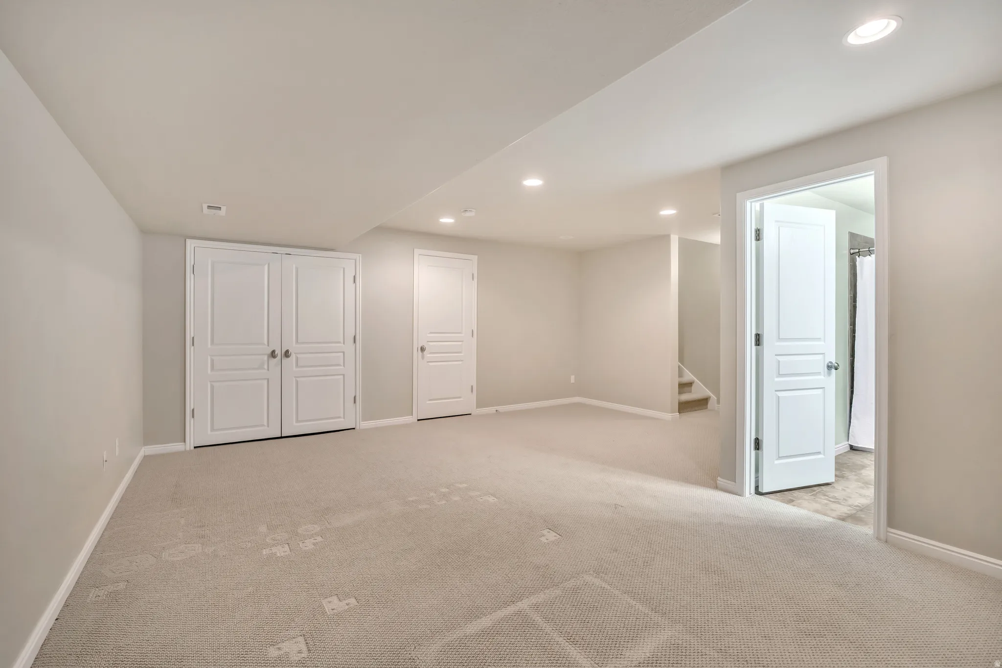 Finished basement featuring carpet flooring and recessed lighting