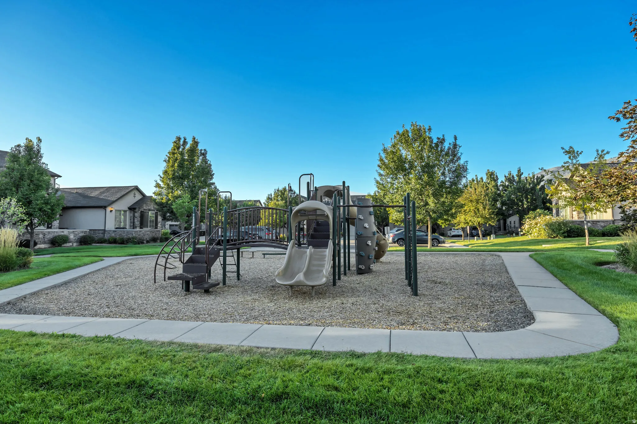 Community jungle gym with a lawn
