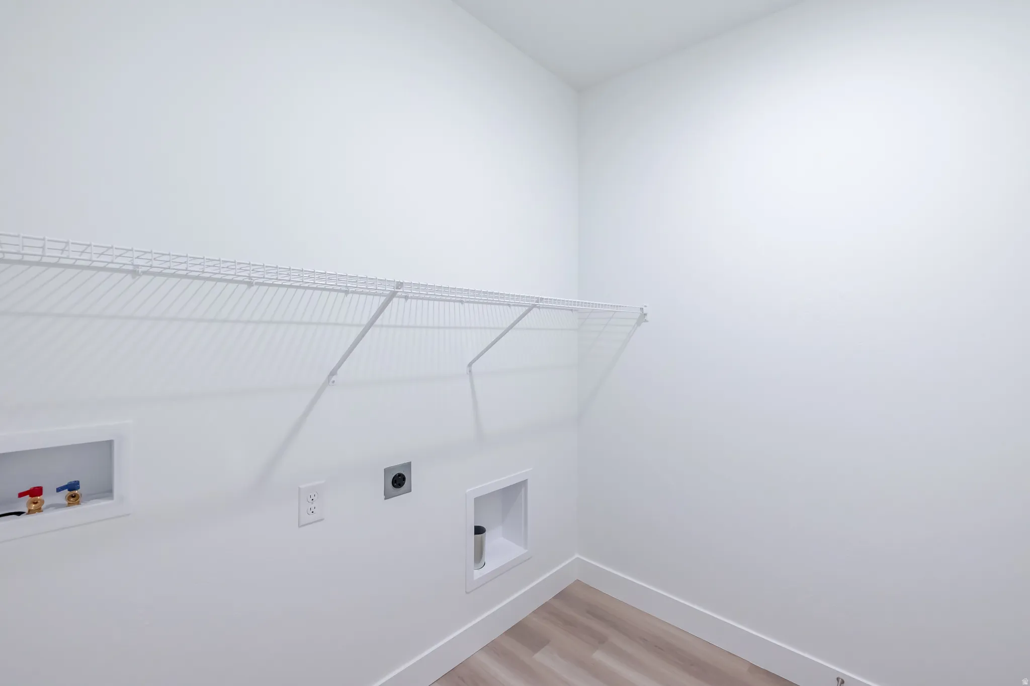 White wire shelving and wood-finish flooring
