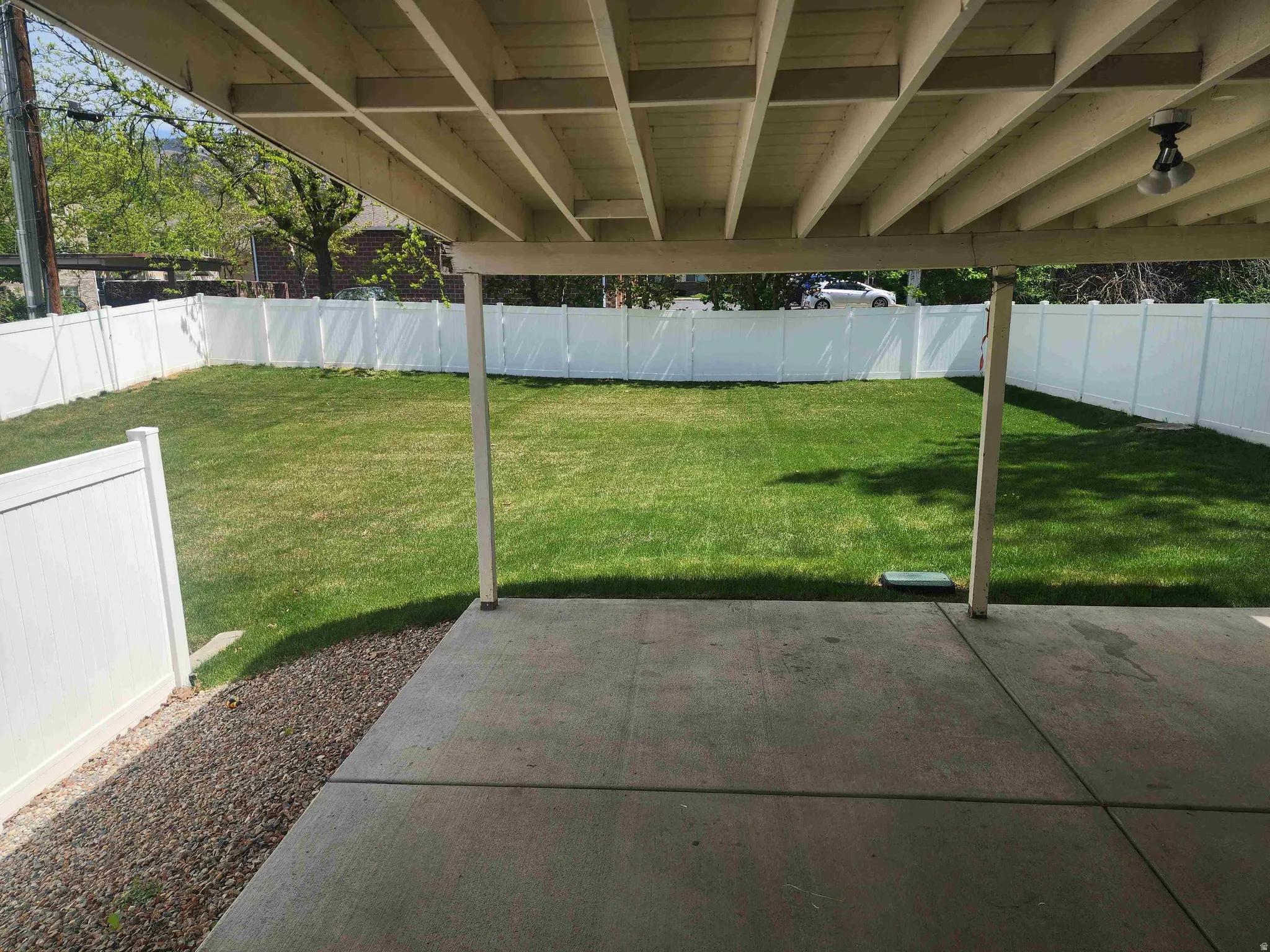 Fenced backyard featuring a patio area