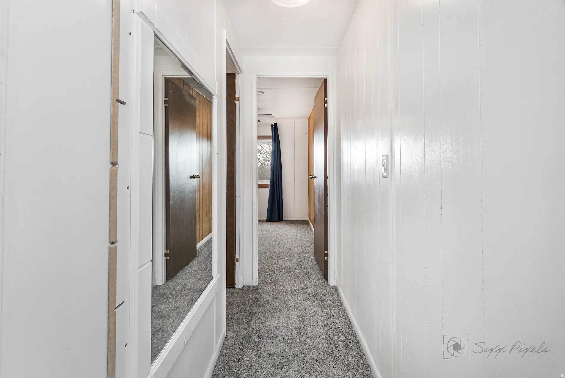 Corridor with dark carpet