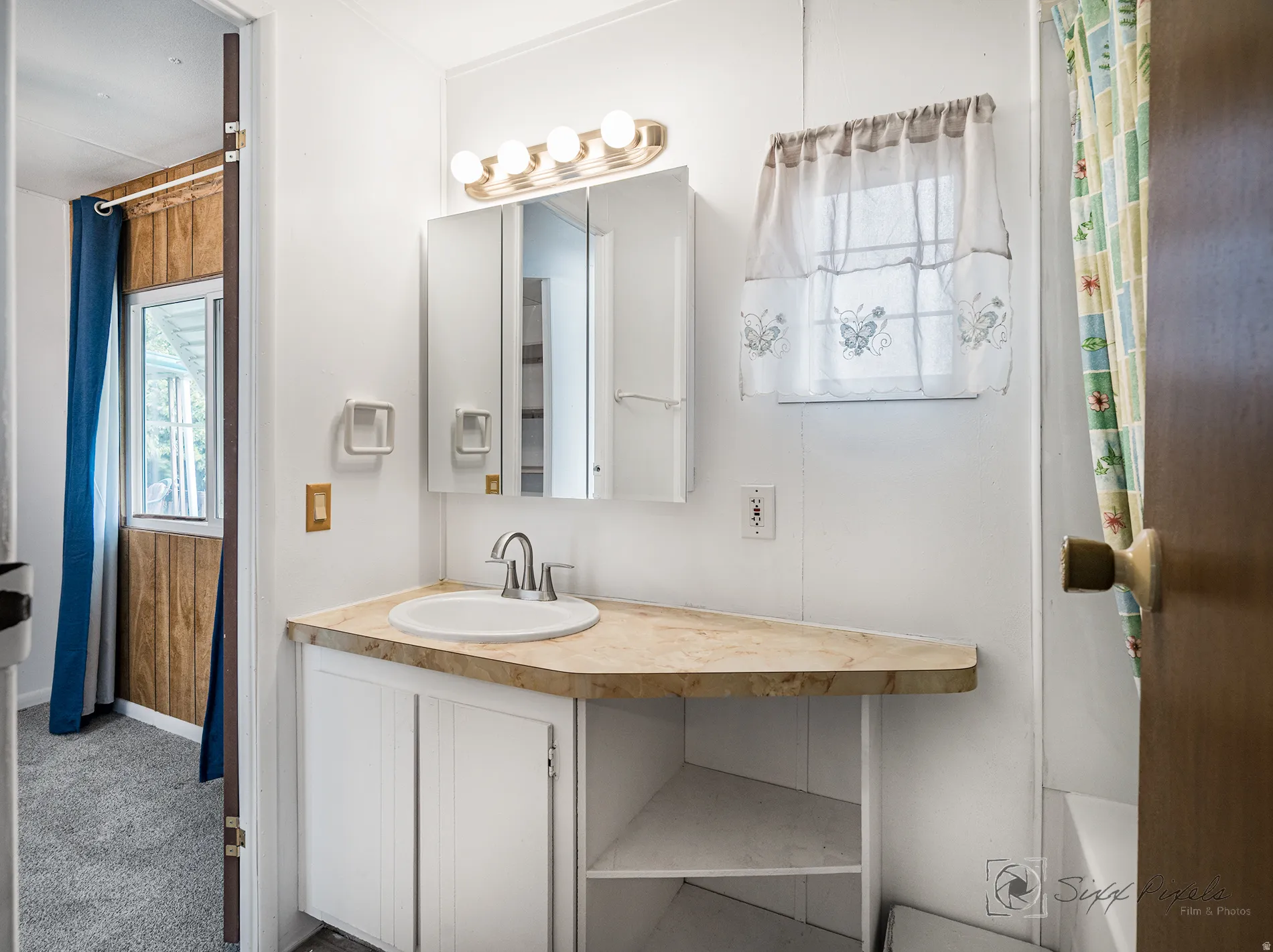 Full bathroom featuring vanity, carpet flooring, and shower / bath combo with shower curtain
