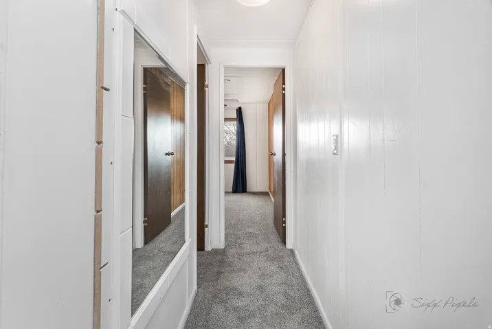 Corridor with dark carpet